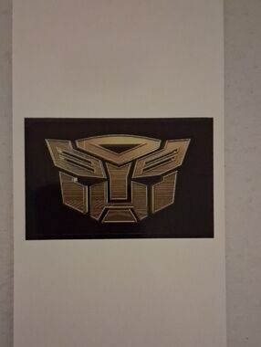 Transformers Autobot Logo Sticker - Metallic Gold on Black